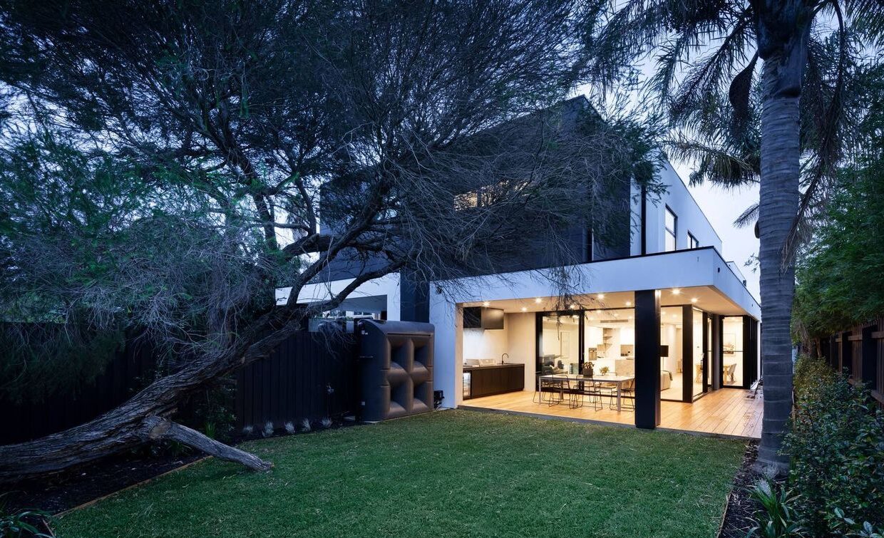 Hornby Street Beaumaris Outside with the beautiful green trees and grass, looking into the double storey home
