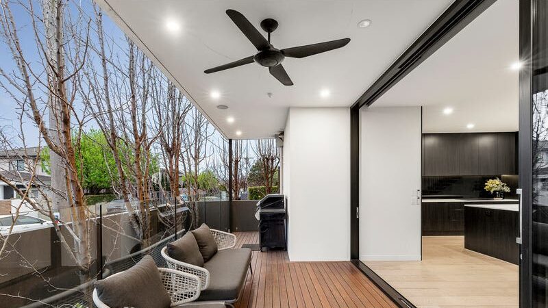 66 thomas st brighton east outdoor area and balcony with chairs and a ceiling fan