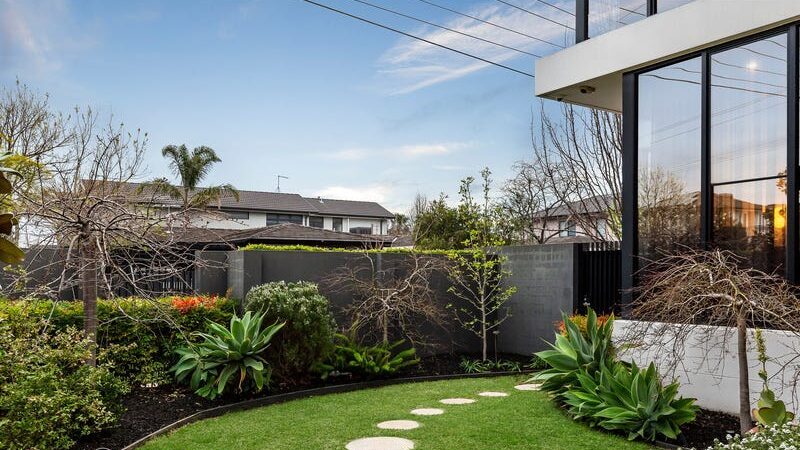 66 thomas st brighton east, outside area and backyard with garden beds and grass with a stone path