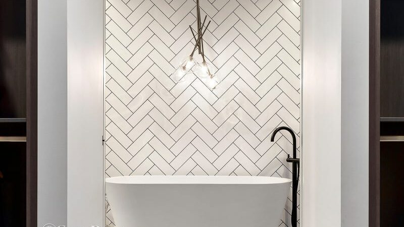 66 thomas st brighton east bathtub with tiled feature wall, hanging feature light, black tap from floor and curved up over bath
